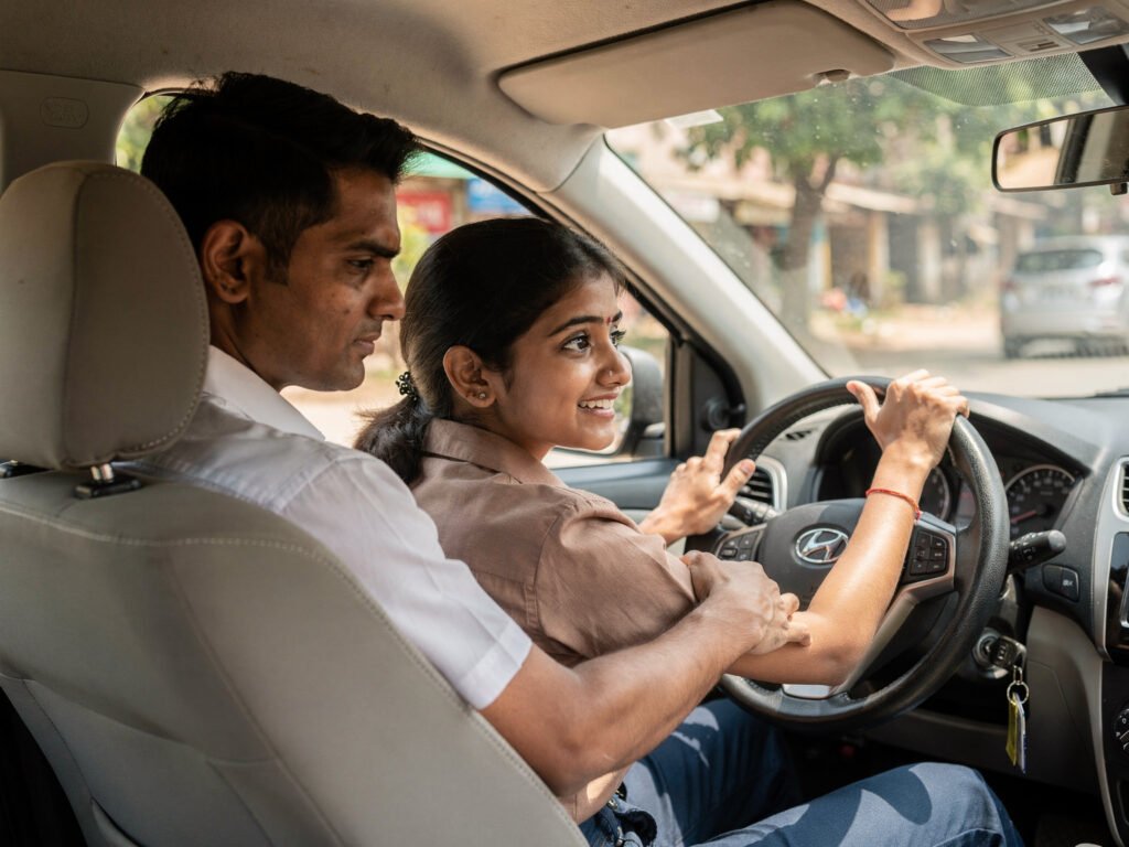 A beginner learner receiving a first driving lesson